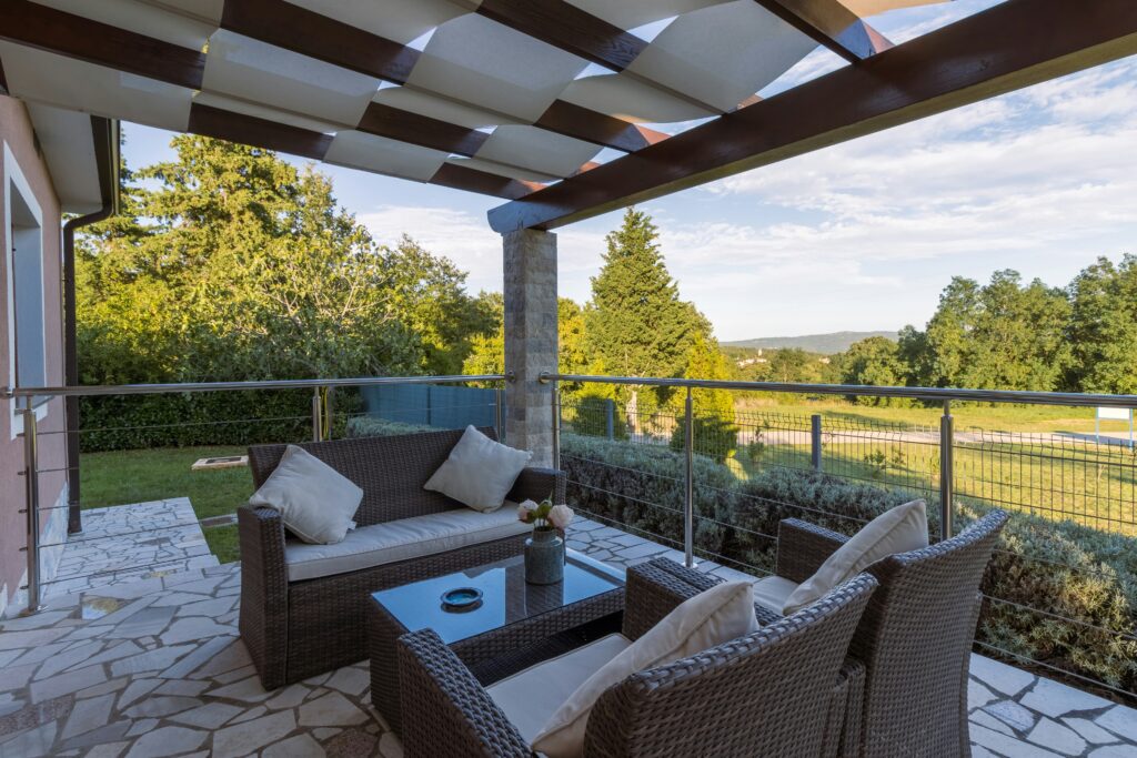 Outdoor living space design with patio, seating, and pergola near Portland