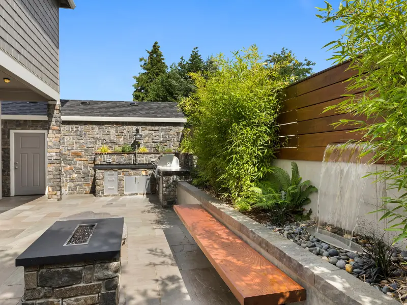 Hardscape contractor setting stone pavers for a patio