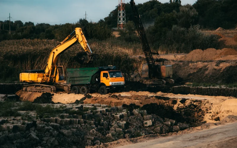 Tracked bulldozer excavating land at a construction site