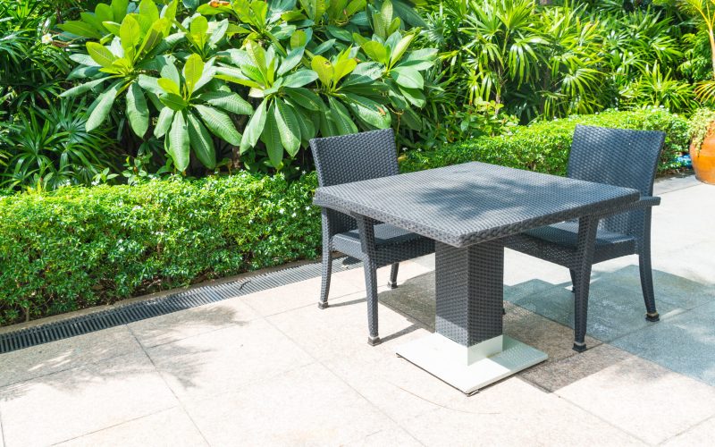 Outdoor patio with empty chair and table